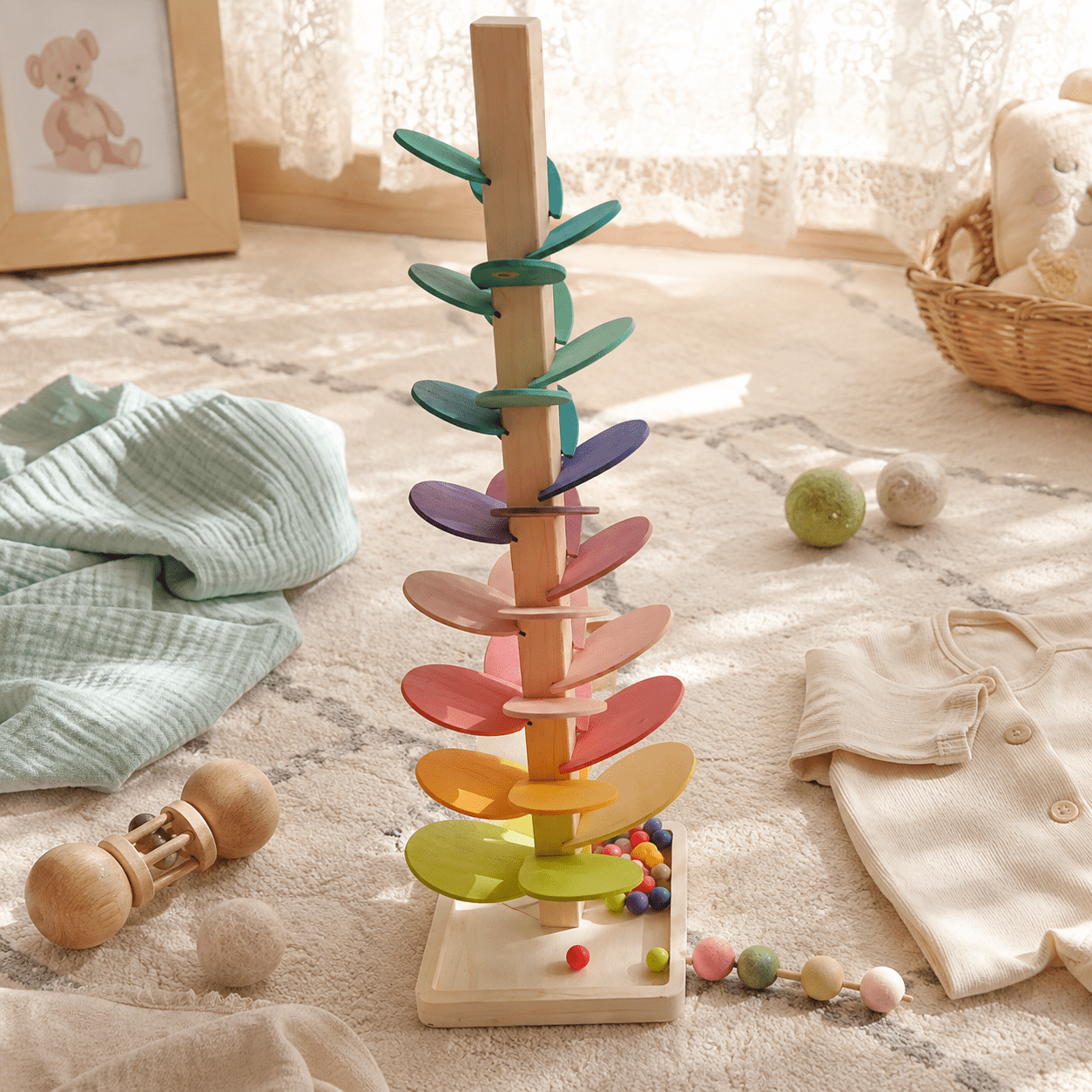 Soothing pastel sound tree supporting soft motor skills development in a calm nursery setting